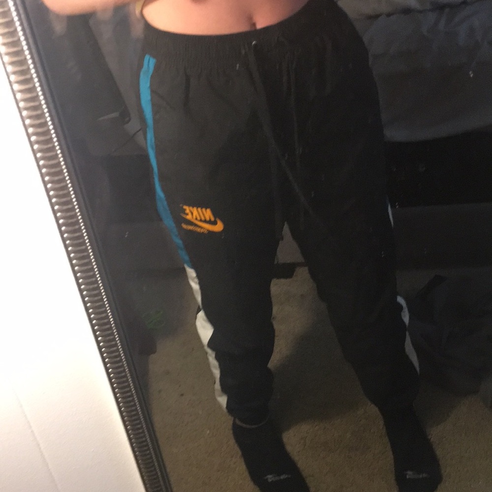 nike sweatpants windbreaker material